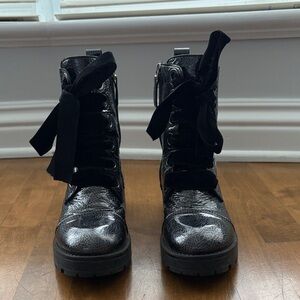 Silver combat boots with black felt lace